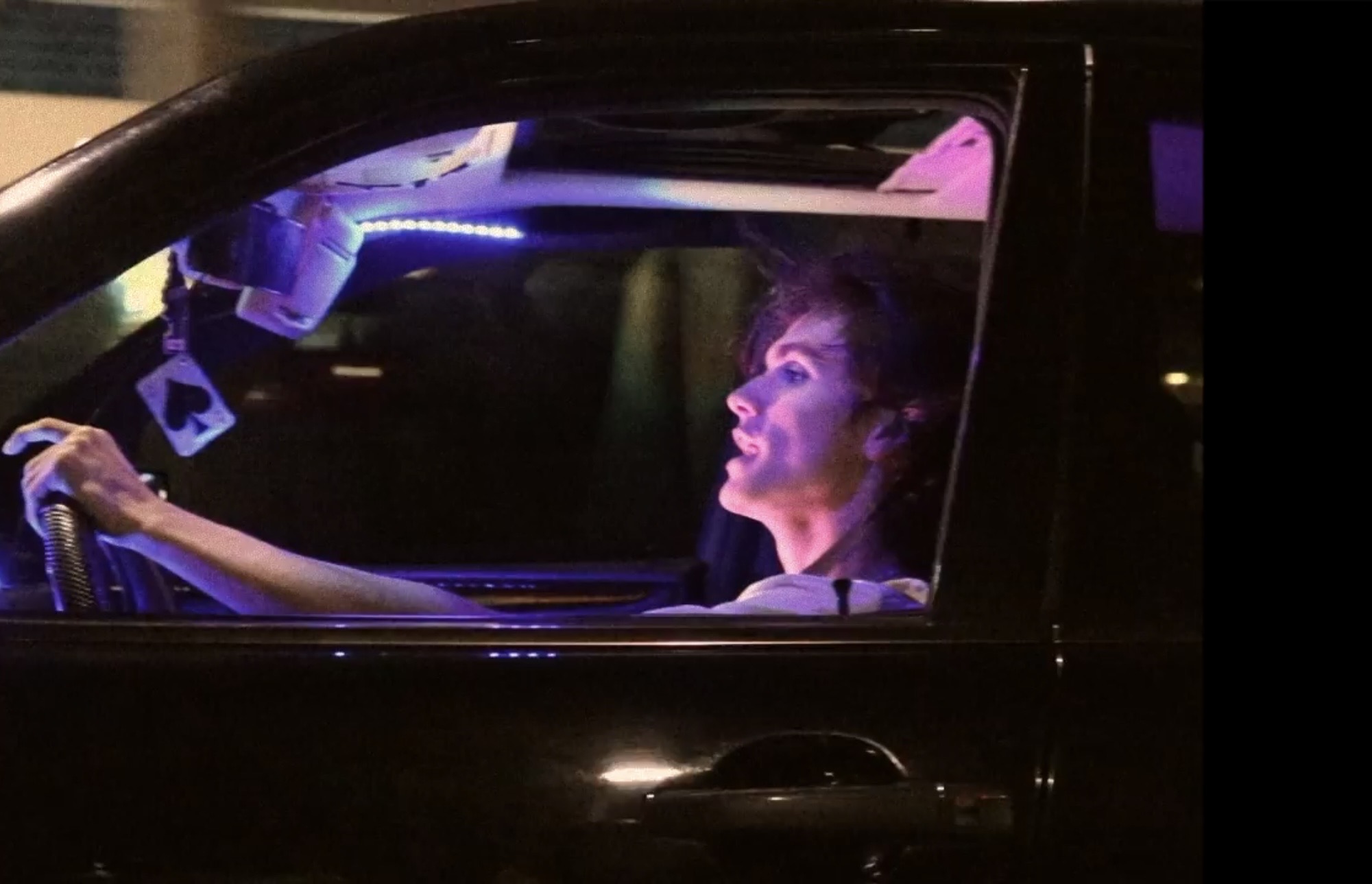 SLOWDOWN music video still, night car scene